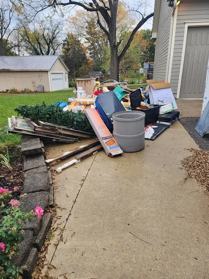Dumpster being loaded with debris for 30 Yard Dumpster Rental in Monticello